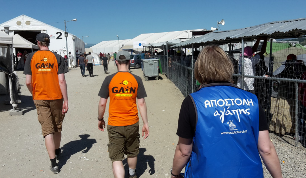 GAiN volunteers walking in camp