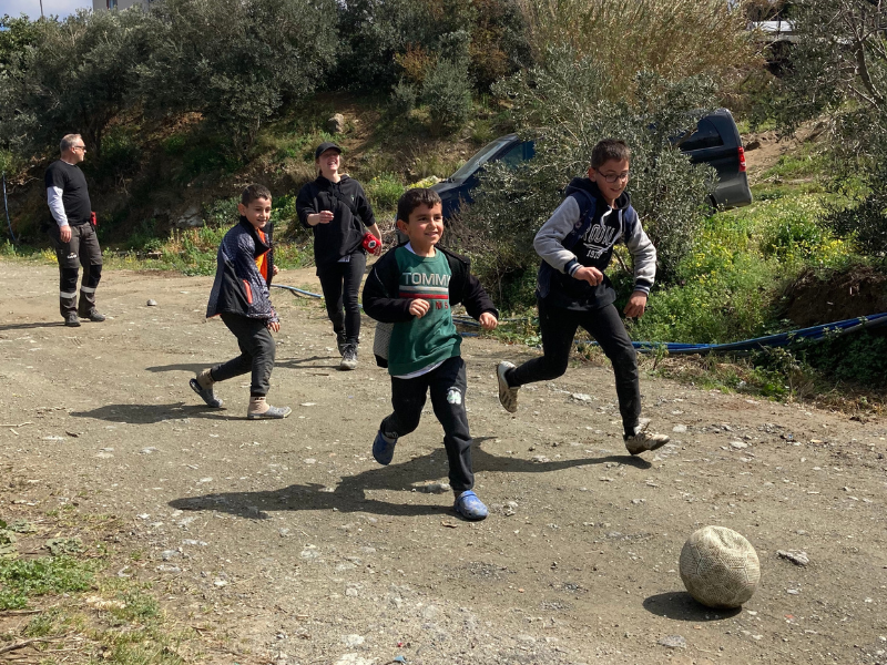 boys playing football